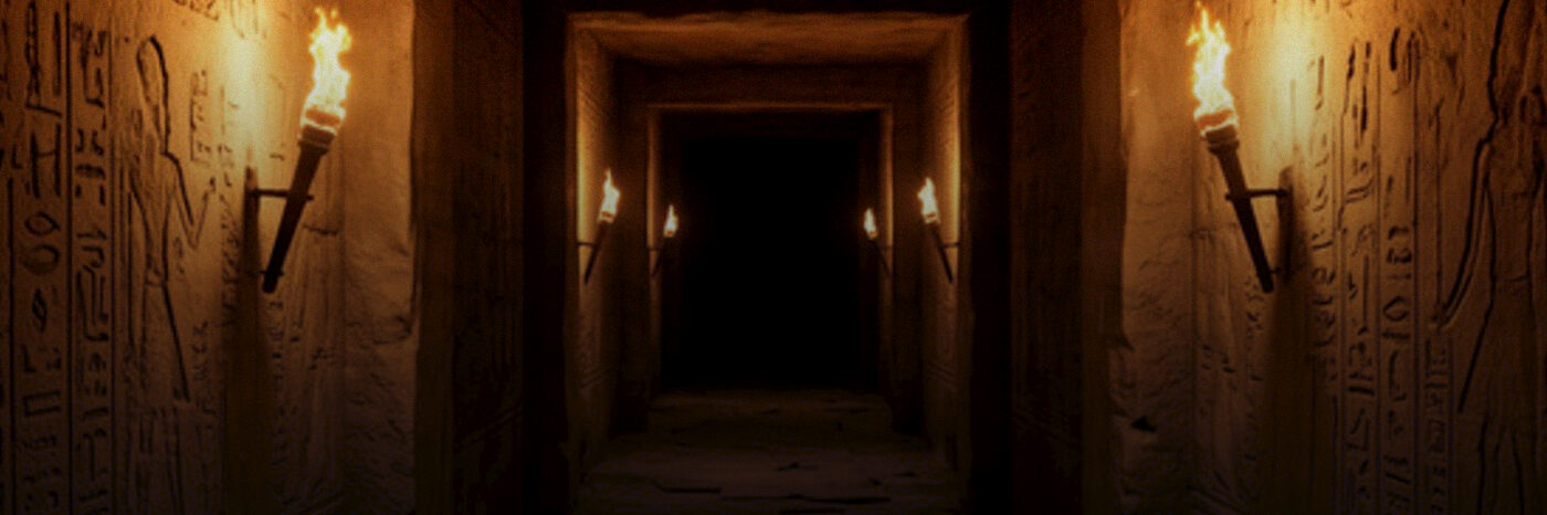 A torchlit Egyptian temple corridor