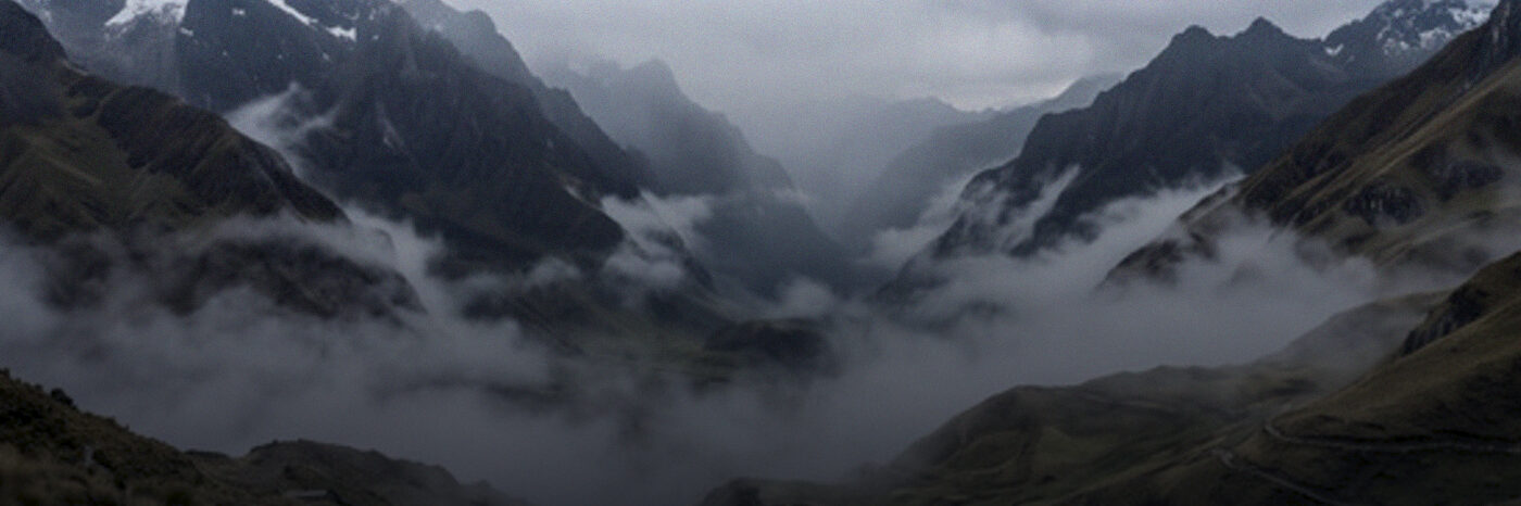 Mist rolling across high mountain peaks
