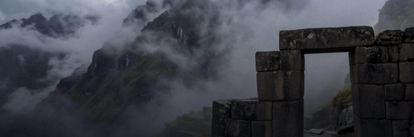 A stone gateway on a high mountain path